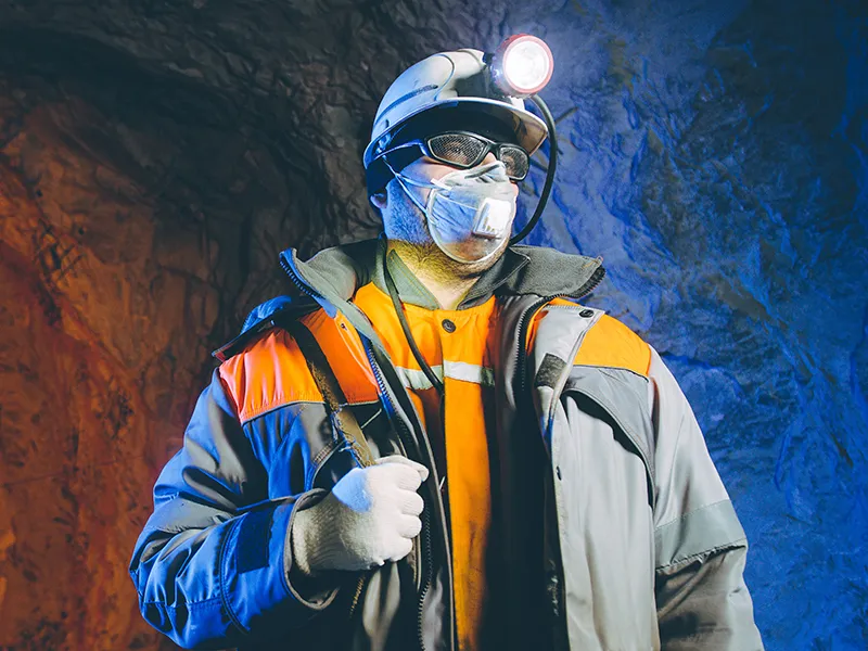 Picture of miner wearing smartsense and safety gear