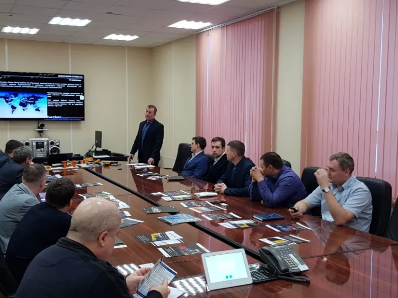 Picture of people around a conference table