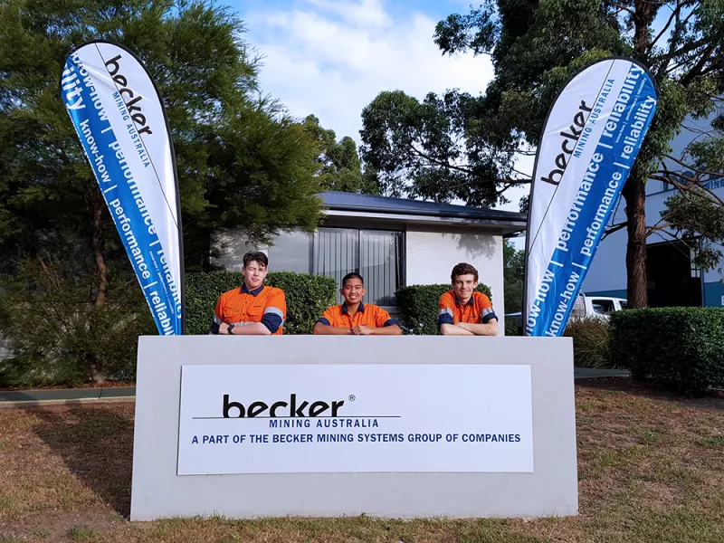 Group of trainees infront the becker australia sign