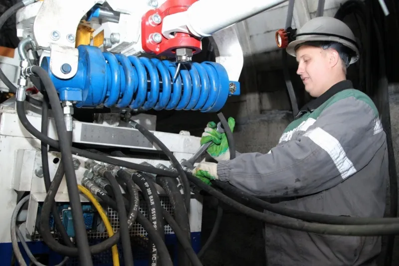 picture of miner working on becker equipment