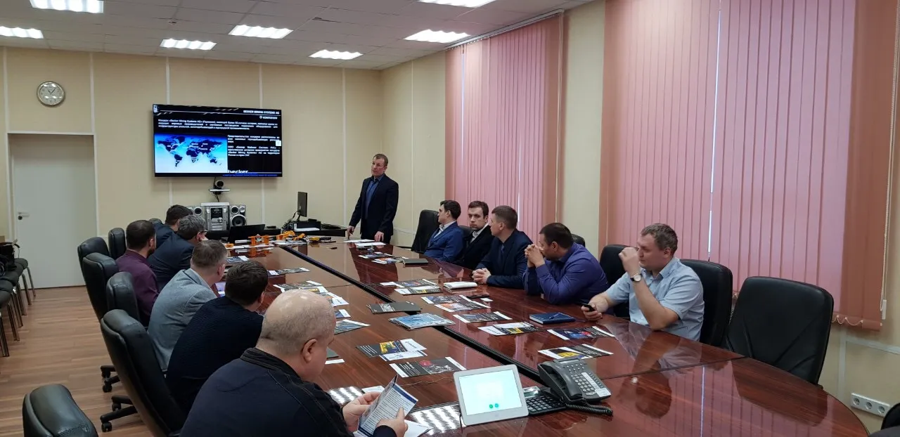 Picture of people around a conference table