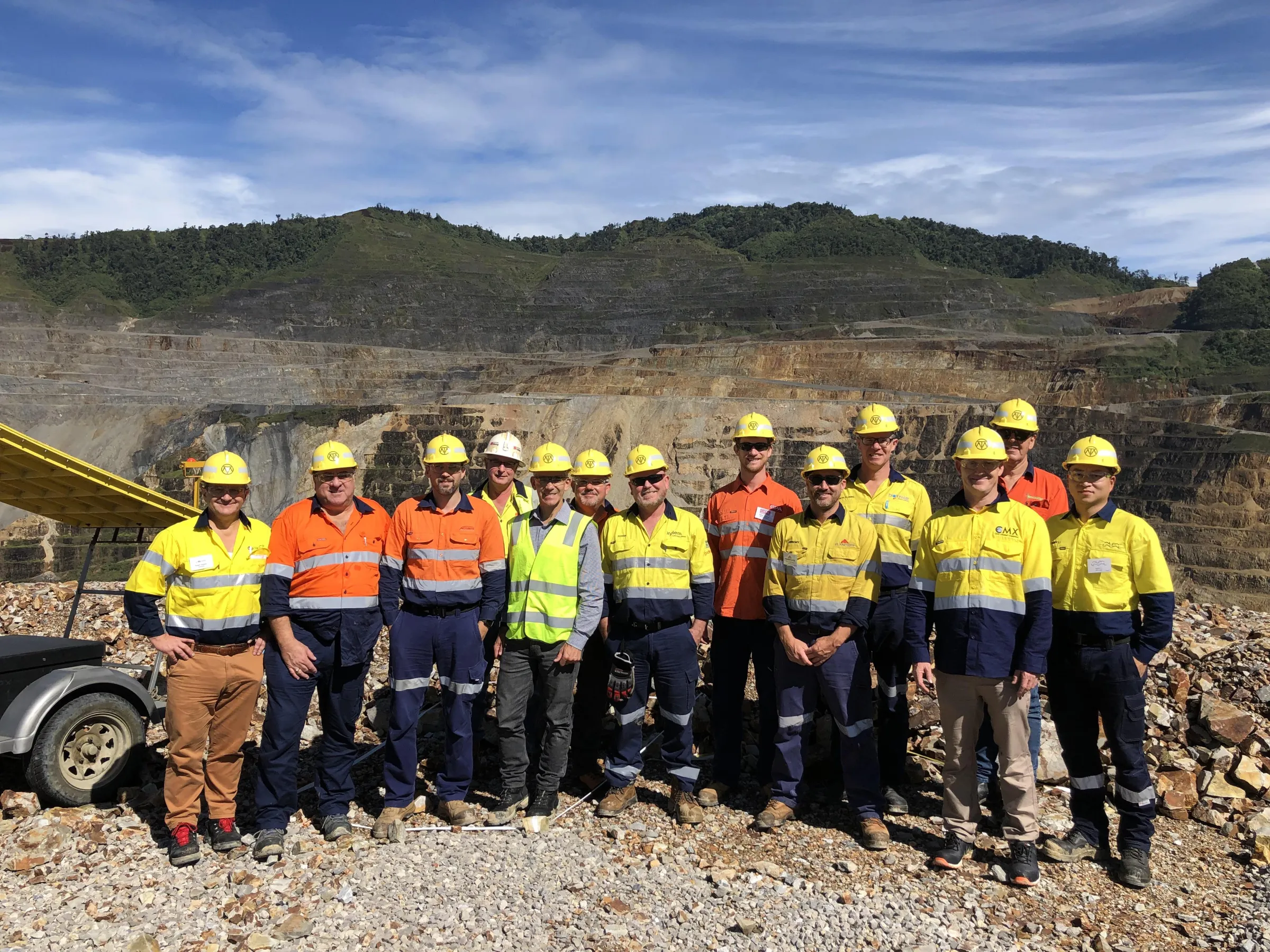 group picture of mining people on mining site