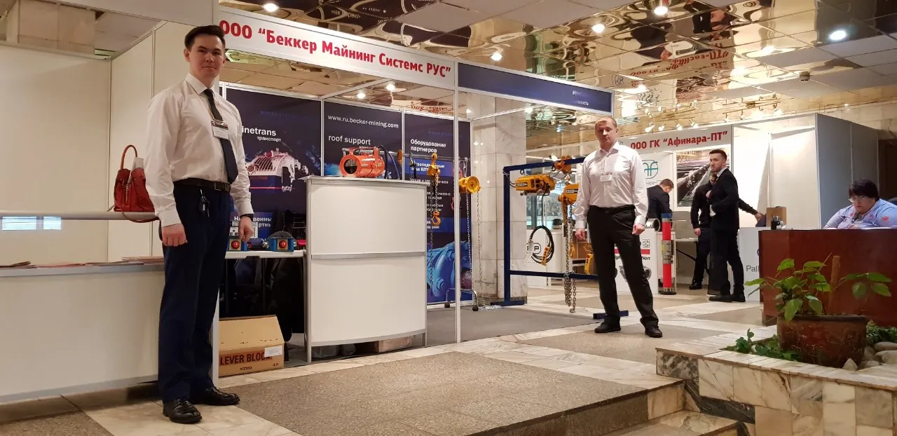 Picture of a trade show booth with people