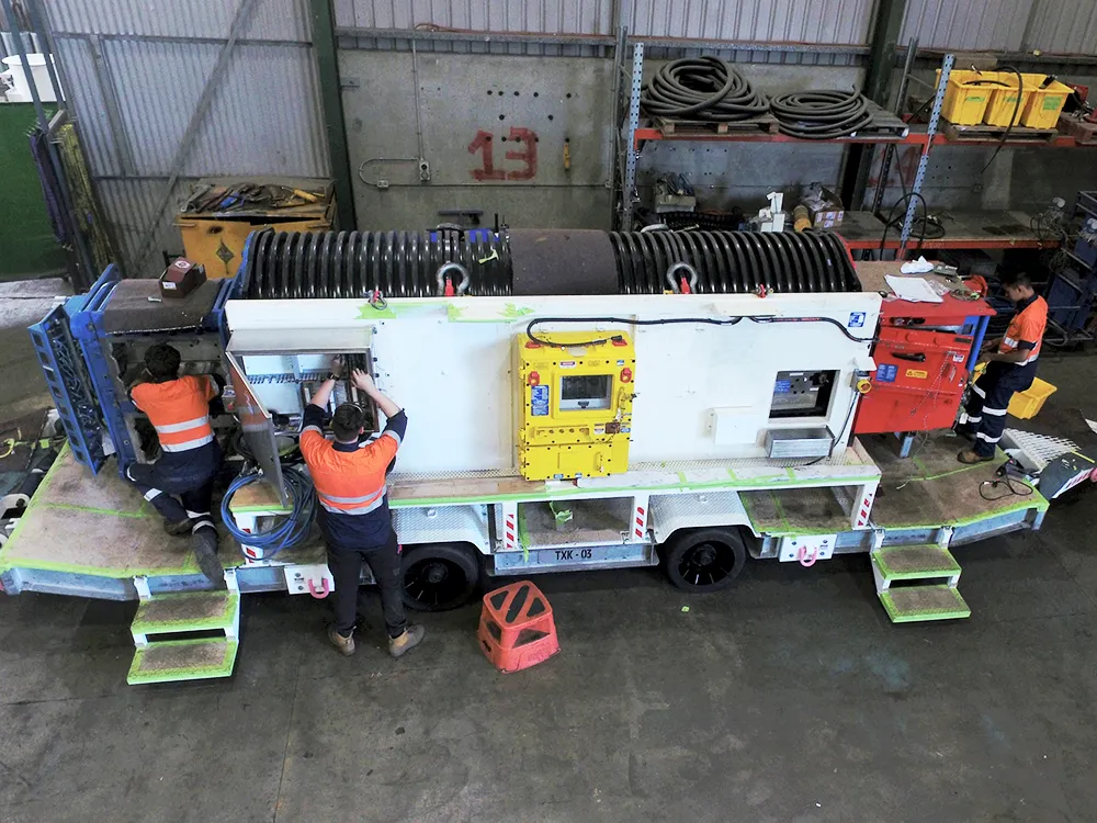 picture of people working on a vehicle